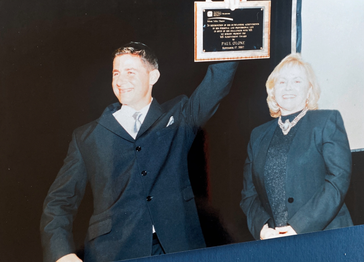 Paul O'Lone holding his MS Achievement Award